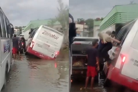 Micro-ônibus tomba ao cair em cratera coberta por água da chuva na Zona Leste de Manaus